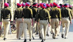 Police personnel patrol the streets at Dhudike village in Faridkot on Wednesday. A tribune photograph 