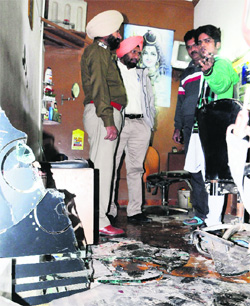Police officials inspect the spot in the Greenfield area on the Majitha road.