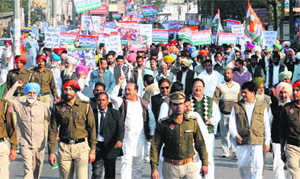 Congress workers hold a protest march in Bathinda on Thursday.