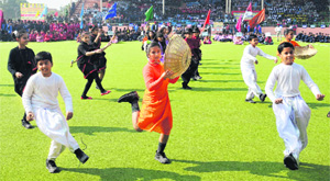 Students perform a cultural item during the opening ceremony at the Hockey Stadium in Bathinda on Thursday.