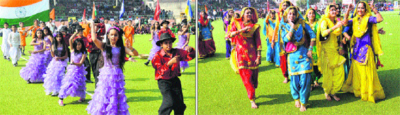 Students perform a cultural item and (right) girls perform dance during the opening ceremony of 59th National School Games at the Hockey Stadium in Bathinda on Thursday.