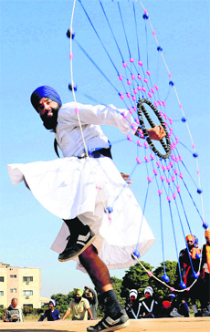 A Nihang performs gatka during the 15th S Sukhdev Singh Gill Sports Festival at Phase VIII in Mohali on Thursday.