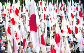 People holding Japanese national flags take part in an anti-China rally in Tokyo in this file photo. Both Japan and India are wary of an increasingly assertive and powerful China.