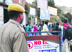 A policeman on duty in a market in Shimla. Photo: Amit Kanwar