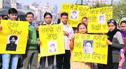 The SSA/RMSA employees hold protest against the state government in support of their demands in Jalandhar on Thursday. A Tribune Photograph