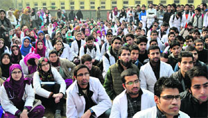 Doctors protest against former Chairman of the Board of Professional Entrance Examination Mushtaq Ahmad Peer for his involvement in the common entrance test scam in Srinagar on Thursday.
