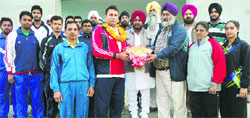 Sports lovers felicitate boxer Gurcharan Singh at Shahi Sports College, Samrala, on Thursday. A Tribune Photograph