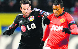 Manchester United's Nani dribbles past a Leverkusen player during the Champions League group A soccer match between Bayer Leverkusen and Manchester United in Leverkusen, Germany.  AP/PTI