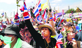 Anti-government protesters rally in front of the national police headquarters in Bangkok on Thursday.