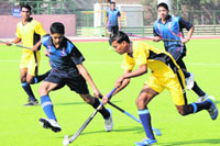 A hockey match in progress during the 59th National School Games in Bathinda on Friday. tribune photo: Pawan Sharma