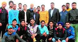 The winning team of DAV College, Sector 10, with the trophy in Chandigarh on Friday