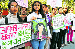 Girls hold placards condemning ‘violence against women’ during a rally at Government Model School-46, Chandigarh, on Friday