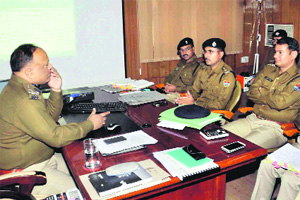 Amit Sinha, DIG, Garhwal Range, at a meeting with district police chiefs in Dehradun on Friday. 