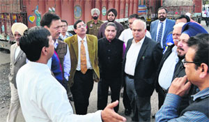 MP Mahinder Singh Kaypee interacts with NHAI officials on the Jalandhar-Phagwara highway in Jalandhar. 