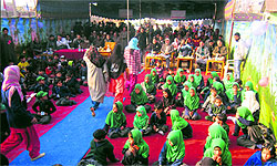 Students of Government Boys Middle School, Razwan, participate in a function to celebrate the Right to Education Day in Budgam on Friday