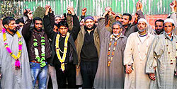 PDP leader Javid Mustafa Mir with National Conference workers who joined the party in Srinagar on Friday