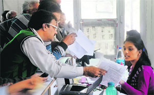 Residents at a counter to submit property tax at the Zone D office of the MC in Ludhiana. 