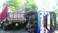 The overturned bus after it hit a truck near Asron village. A Tribune photo