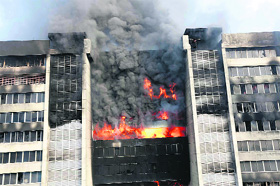 Smoke rises from a fire at a Standard Group garment factory in Gazipur on Friday.