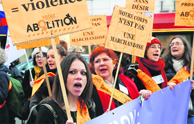People demonstrate against prostitution outside Parliament in Paris on Friday.