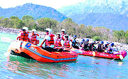 Rafting teams during a warm-up session on the first day of the national-level rafting championship on the Chenab in Reasi on Saturday