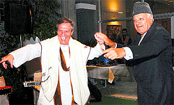 Union New and Renewable Energy Minister Farooq Abdullah and German Ambassador to India Michael Steiner at an evening of Kashmiri music at the German Embassy in New Delhi on Saturday. Music legend Pandit Bhajan Sopori, together with the Kashmiri musicians who had participated in the Zubin Mehta concert in Srinagar, presented the SaMaPa Award 2013 to Ambassador Steiner
