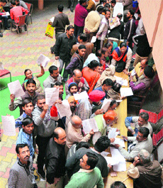 Residents file their property tax returns at the MC Zone A office in Ludhiana on Saturday. 
