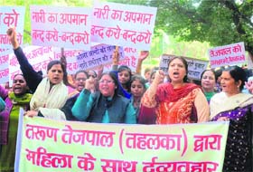 Women activists protest against Tehelkas former editor-in-chief Tarun Tejpal at Jantar Mantar, New Delhi. Tejpal has been booked on rape charge by the Goa police