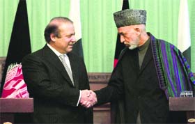 Afghan President Hamid Karzai with Pakistani PM Nawaz Sharif during a joint press conference in Kabul on Saturday
