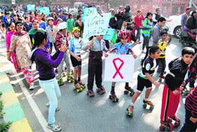 Children hold an awareness rally to mark World AIDS Day in Amritsar