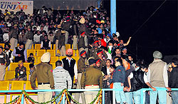 VVIP pass holders jostle for space in the aisle next to the VVIP gallery at the Multipurpose Stadium in Bathinda on Saturday