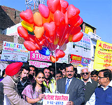 ADC Sonali Giri (left) and Civil Surgeon Dr Ajay Sahni release balloons into the air on World AIDS Day in Bathinda on Sunday