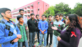 Pooja Thakur, president of the Chandigarh Network of Positive People, talks to PU students in Chandigarh on Sunday.