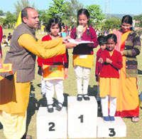 Students being awarded prizes at the annual function celebration at Gayatri Vidyapeeth at Shantikunj in Haridwar on Sunday.