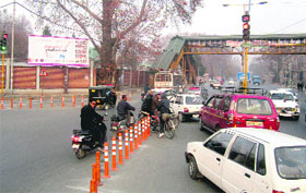 Vehicles jump the traffic signal in Srinagar.