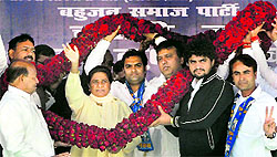 BSP Supremo Mayawati being felicitated during an election rally at Narela in New Delhi on Saturday