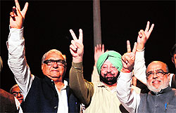 Haryana CM Bhupinder Singh Hooda, Punjab ex-CM Capt Amarinder Singh and Wazirpur candidate Hari Shankar Gupta during a rally in Delhi on Sunday