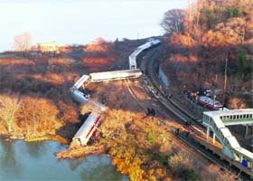 The derailed Metro-North train in the Bronx neighbourhood of New York on Sunday