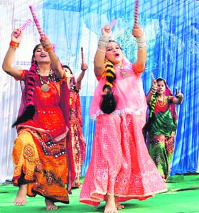 Colourful celebration: Students of Luvdale Senior Secondary School present an item during the annual day function of the school in Amritsar