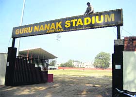 Workers spruce up the Guru Nanak Stadium ahead of World Cup Kabaddi matches in Amritsar on Monday