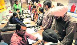 Rush of consumers at the office of an LPG dealer at Burail on Monday. Tribune photo