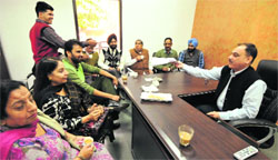 Councillor Mukesh Bassi hears the grievances of residents of his ward in Chandigarh on Monday. tribune photo: