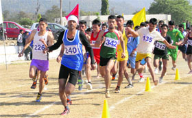 Athletes take part in the 39th HNB Garhwal University Athletics Meet in Dehradun on Monday.