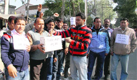 Striking Power contractual employees resort to begging to get their demands fulfilled in Dehradun on Monday.