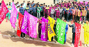 Flag bearers of various districts at the sixth state-level sports meet for special sportspersons at Dhalpur on Monday