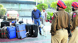 Security personnel frisk the luggage of hotel guests where kabaddi players are staying in Jalandhar on Monday