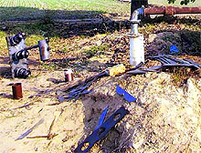 Parts of an electricity transformer lying on a field in Jagraon