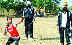 An athlete in action during a shot put event at Lopon village on Monday