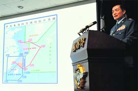 A Taiwanese air force official talks about Chinas newly declared air defence zone in Taipei on Monday