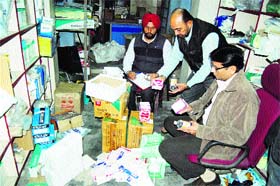 Health Department officials with the drugs seized during the raid at an illegal medicines godown at Katra Sher Singh in  Amritsar on Tuesday